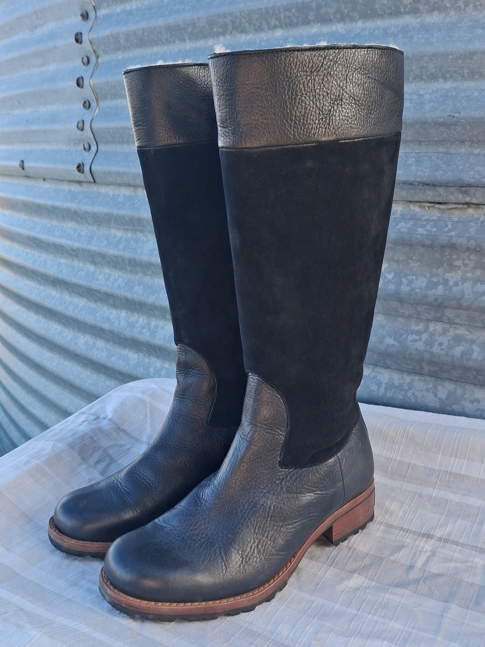 Ugg knee high shearling lined leather boot with rubber sole size 9, barely worn